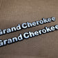 93-98 Jeep Grand Cherokee OEM 55295445 Metal Emblem Pair Set Front Fender Badge