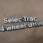 84-01 Jeep Wagoneer Cherokee XJ Selec-Trac Metal Emblem Badge Select Track OEM