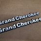 93-98 Jeep Grand Cherokee OEM 55295445 Metal Emblem Pair Set Front Fender Badge